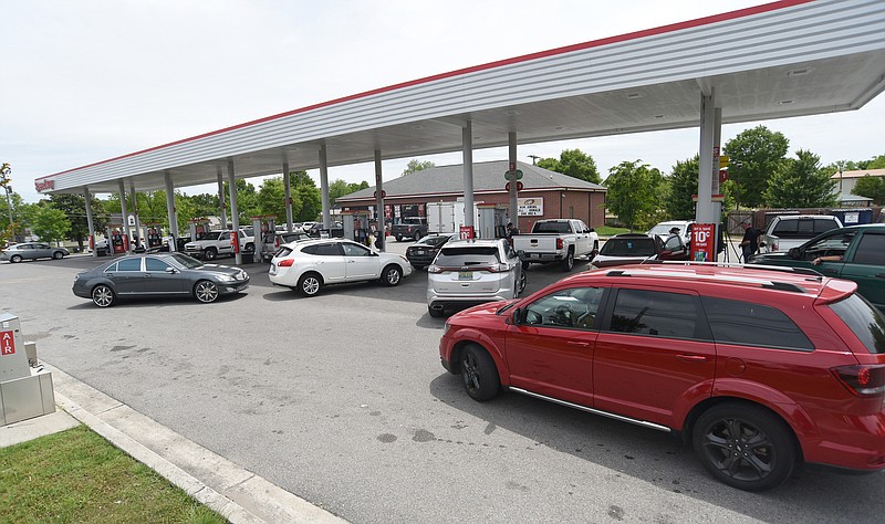 Staff Photo by Matt Hamilton / Drivers fill their gas tanks at the Speedway in East Ridge earlier this week.