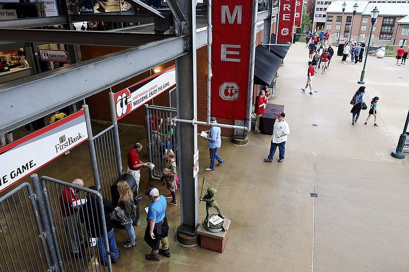 Staff photo by C.B. Schmelter / Fans enter the gates at AT&T Field on May 4, opening day for the Chattanooga Lookouts.