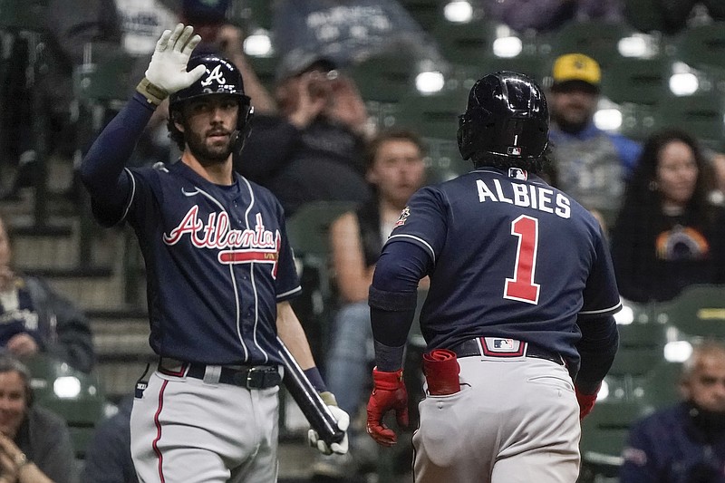 AP photo by Morry Gash / Atlanta Braves second baseman Ozzie Albies is congratulated by shortstop Dansby Swanson after hitting a home run during the fifth inning of Friday's road game against the Milwaukee Brewers.