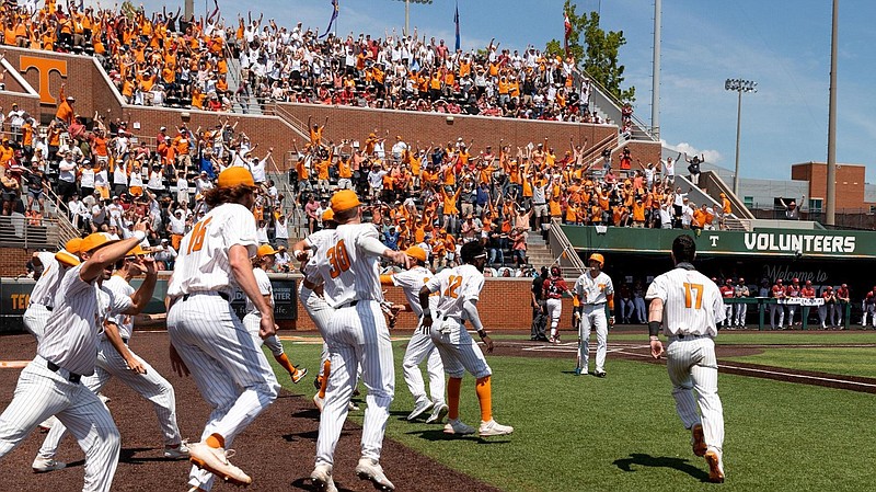 Tennessee Athletics photo / Tennessee players and fans erupt at Lindsey Nelson Stadium on Saturday after Max Ferguson's three-run home run to right field in the ninth inning propeled the No. 4 Volunteers to an 8-7 win over No. 1 Arkansas.