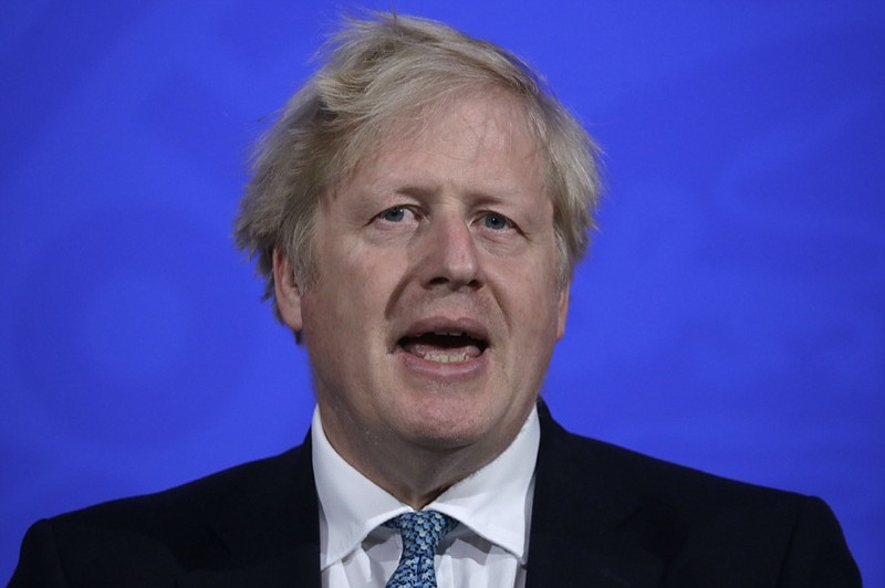 Britain's Prime Minister Boris Johnson speaking at a press conference about the ongoing coronavirus outbreak, in London, Friday, May 14, 2021. (AP Photo/Matt Dunham, Pool)


