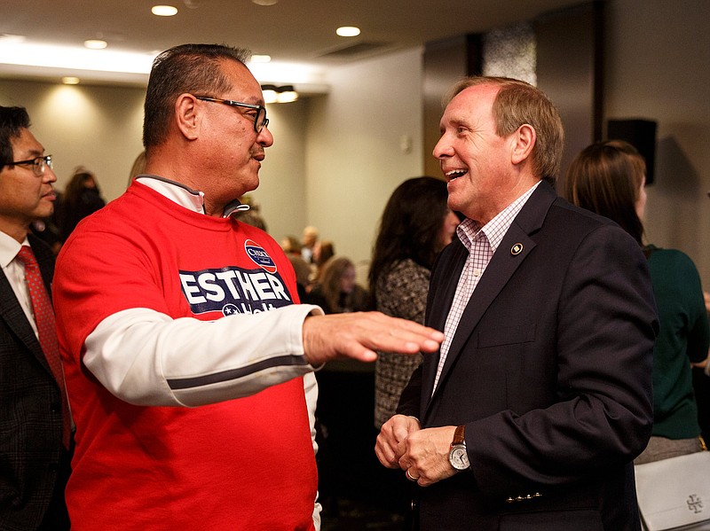 Staff photo by Doug Strickland / Tennessee Rep. Mike Carter, right, speaks with Mike Thomas at a GOP election returns party at the Doubletree Hotel on Tuesday, Nov. 6, 2018, in Chattanooga, Tenn.
