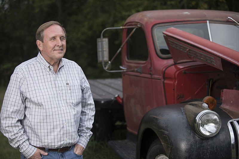 Staff photo by Troy Stolt / Tennessee State Rep. Mike Carter poses for a portrait next to his 1940's flatbed truck on Monday, Sept. 28, 2020, in Ooltewah, Tenn.