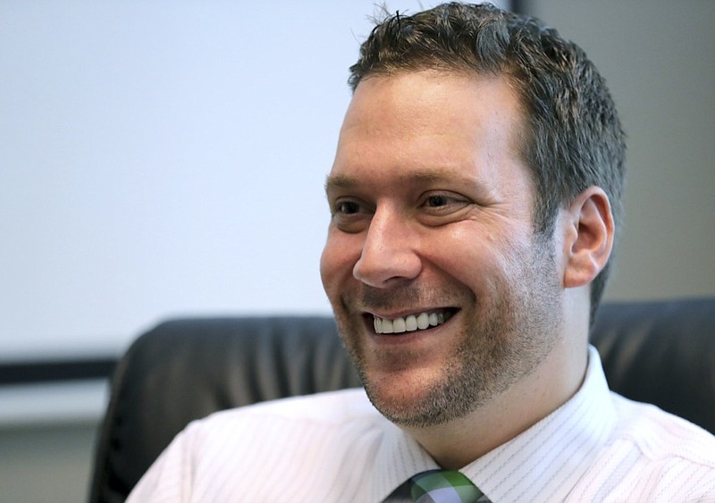 FILE — In this Sept. 30, 2019, file photo, Seminole County Tax Collector Joel Greenberg talks to the Orlando Sentinel during an interview at his office in Lake Mary, Fla. A key figure in the federal investigation of Republican Rep. Matt Gaetz is expected to plead guilty to criminal charges next week.  Joel Greenberg will appear Monday in federal court in Orlando, Florida for a change of plea hearing, according to court documents. (Joe Burbank/Orlando Sentinel via AP, File)