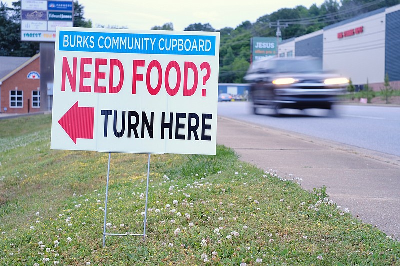 Staff photo by Wyatt Massey / A sign for the Burks United Methodist Church community cupboard on Hixson Pike is pictured on May 18, 2021. The church launched the cupboard in April to address concerns about food insecurity in Hamilton County during the COVID-19 pandemic.