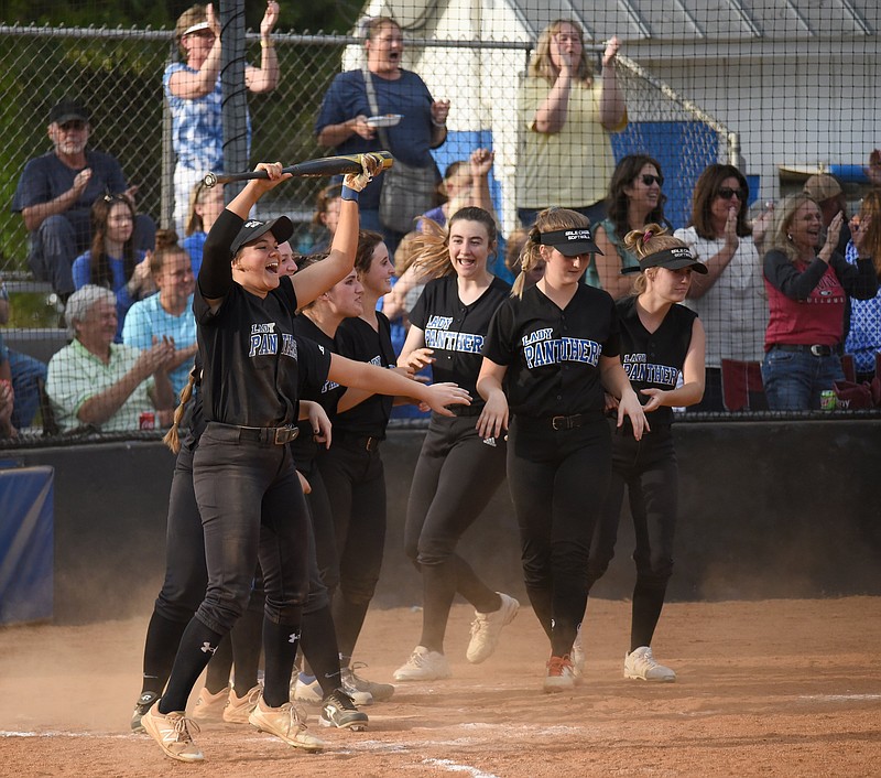 Staff photo by Matt Hamilton / Sale Creek softball players come out of the dugout to celebrate Brooke Raines' two-run homer during the sixth inning of the Region 3-A title game against visiting Oliver Springs on Wednesday night.