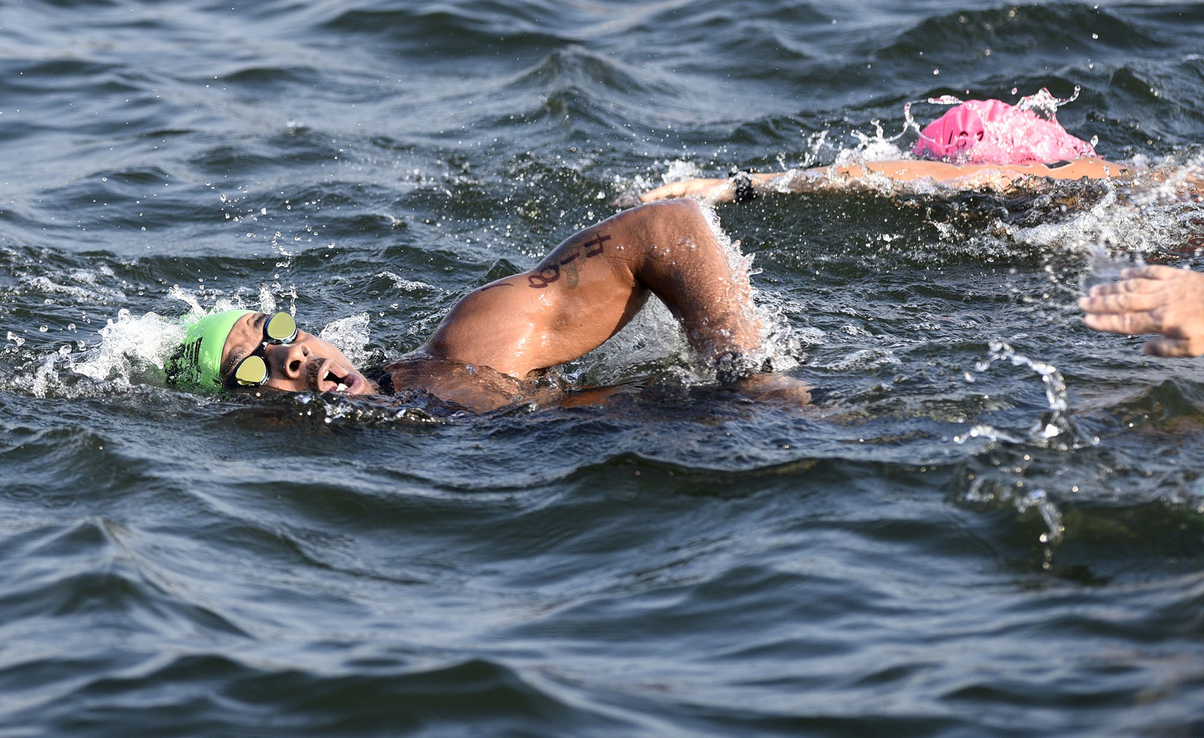 Staff file photo by Robin Rudd / Richard Turner is close to completing his swim at Ross's Landing at the Little Debbie Ironman Chattanooga that took place under hot conditions on September 29, 2019.