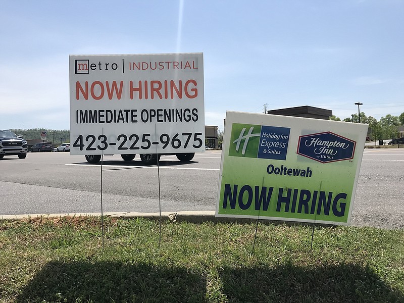 Hiring signs in Ooltewah display efforts by local employers to lure more applicants to fill job vacancies.