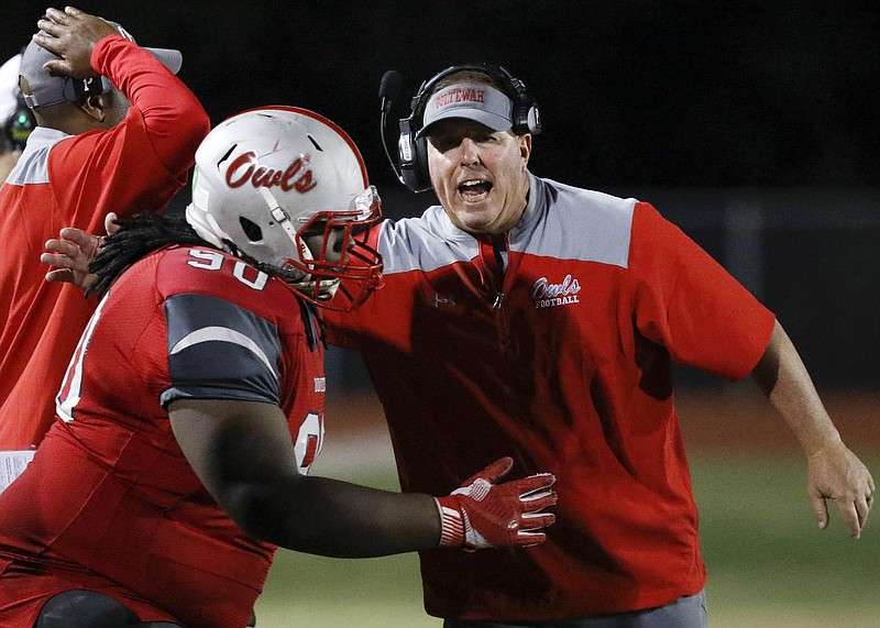 Staff photo by C.B. Schmelter / Scott Chandler, right, who resigned at Ooltewah in February after three seasons as the Owls' head football coach, has been hired by Tyner to lead its program.