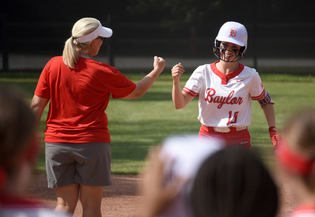 Staff Photo by Matt Hamilton / Baylor coach Kelli Smith congratulates Baylor (10) Ace Sellers after her first home run in the top of the first of the second game against Briarcrest at Baylor School on Friday, May 21, 2021.