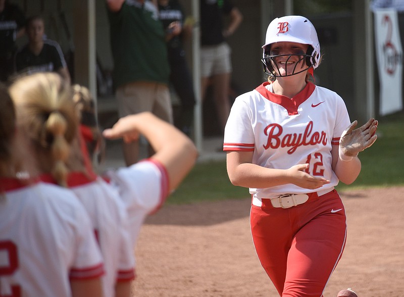 Staff photo by Matt Hamilton / Baylor's Katie Raper is greeted by her teammates at the plate after she hit a three-run homer during Friday's Division II-AA state quarterfinal matchup against visiting Briarcrest. The Lady Red Raiders won 12-0 and 18-1 to sweep the best-of-three series and advance to next week's Spring Fling in Murfreesboro.