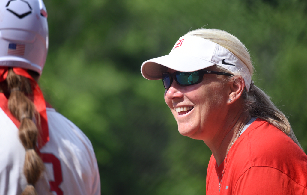 Staff Photo by Matt Hamilton / Head coach Kelli Smith talks with a player between innings at Baylor School on Friday, May 21, 2021.