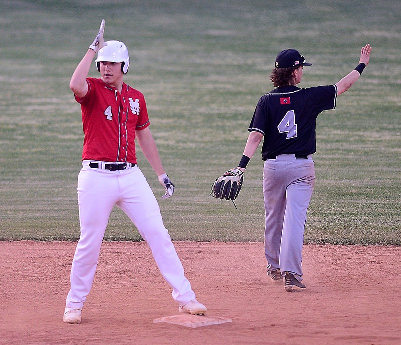 Staff photo by Robin Rudd / Signal Mountain's Hunter Davis, left, acknowledges his teammates after hitting a two-run double to give the Eagles the lead during their Class AA sectional against visiting DeKalb County on Friday.