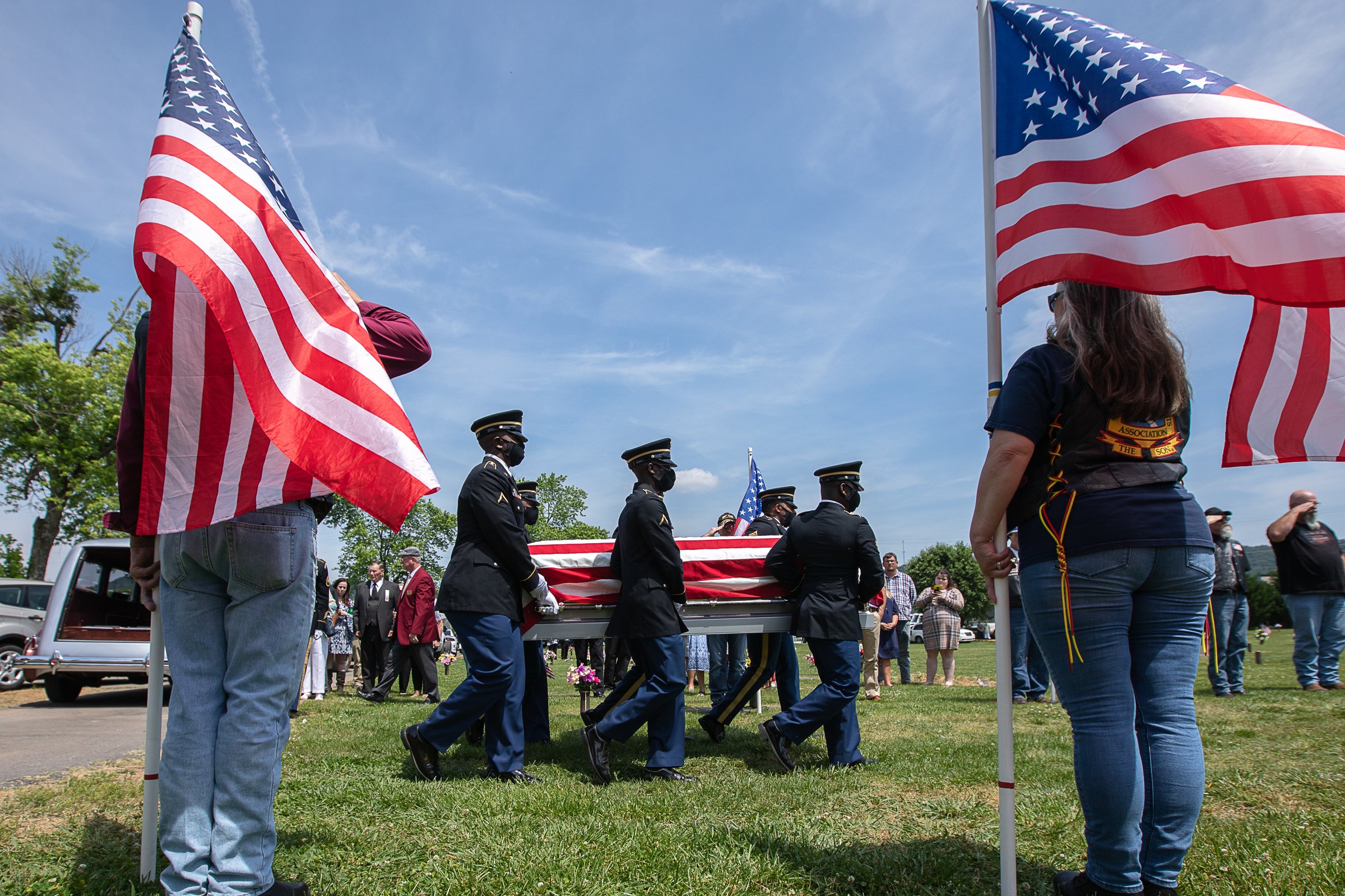 Staff photo by Troy Stolt / Military Pallbearers bring Army Cpl. Henry L. Helms to his final resting place at Anderson Memorial Gardens on Saturday, May 22, 2021 in Ringgold, Georgia. Helms, who was ruled missing in action for seven decades, was identified by his family and given full honors with funeral rites after a 2018 meeting between North Korean Chairman Kim Jong Un and former President Donald Trump, in which an agreement was struck to repatriate remains of Americans collected from the Korean War.