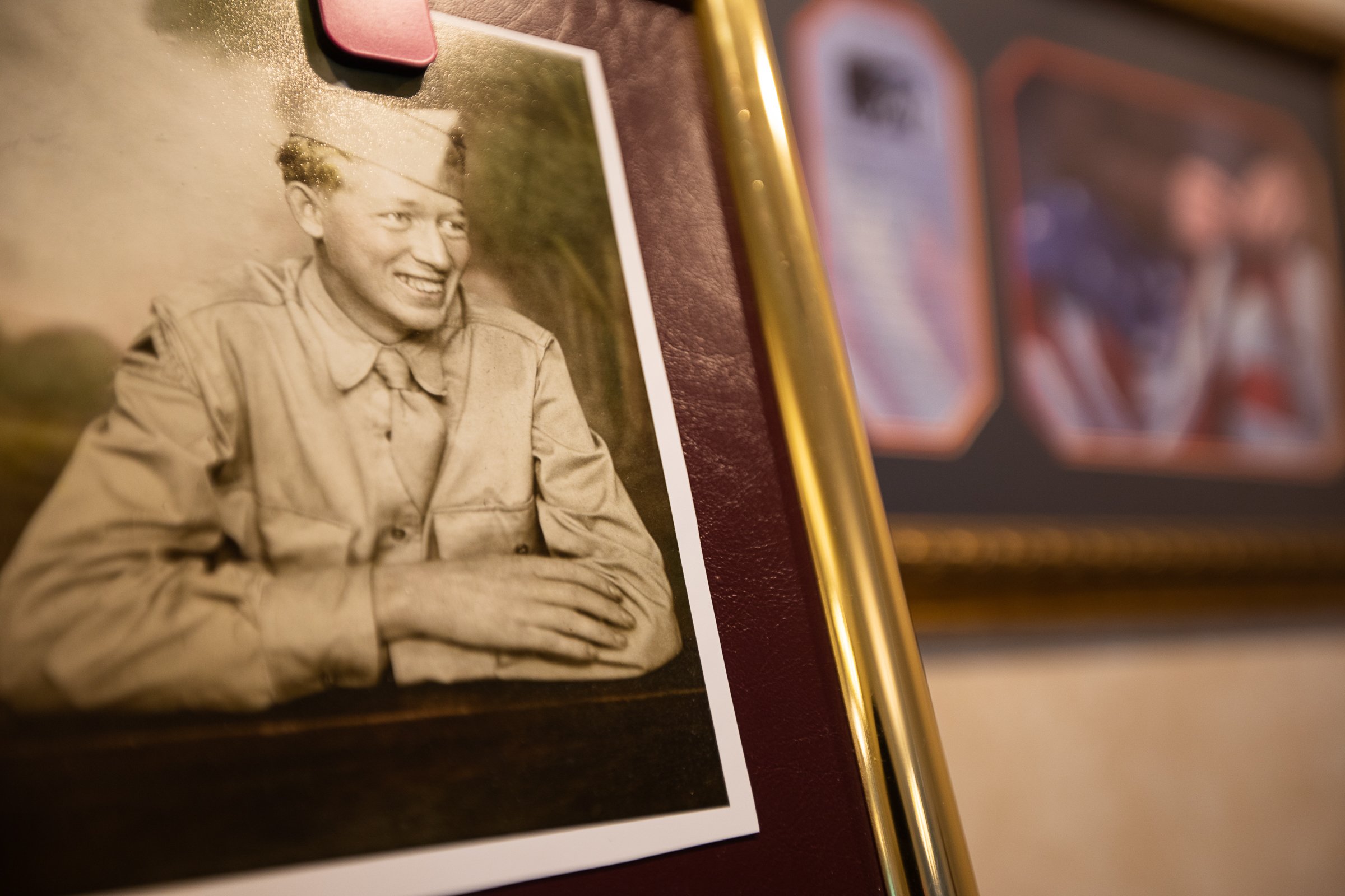 Staff photo by Troy Stolt / A photograph of Army Cpl. Henry L. Helms, who was killed in action during The Battle of Chosin Reservoir during the Korean War is seen inside of the Wilson Funeral Home on Saturday, May 22, 2021 in Ringgold, Georgia. Helms, who was ruled missing in action for seven decades, was identified by his family and given full honors with funeral rites after a 2018 meeting between North Korean Chairman Kim Jong Un and former President Donald Trump, in which an agreement was struck to repatriate remains of Americans collected from the Korean War.