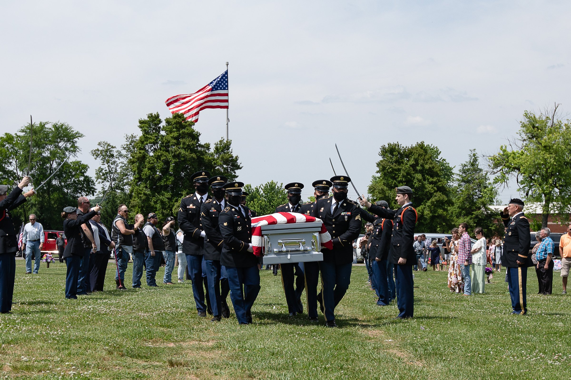 Staff photo by Troy Stolt / Military Pallbearers bring Army Cpl. Henry L. Helms to his final resting place at Anderson Memorial Gardens on Saturday, May 22, 2021 in Ringgold, Georgia. Helms, who was ruled missing in action for seven decades, was identified by his family and given full honors with funeral rites after a 2018 meeting between North Korean Chairman Kim Jong Un and former President Donald Trump, in which an agreement was struck to repatriate remains of Americans collected from the Korean War.