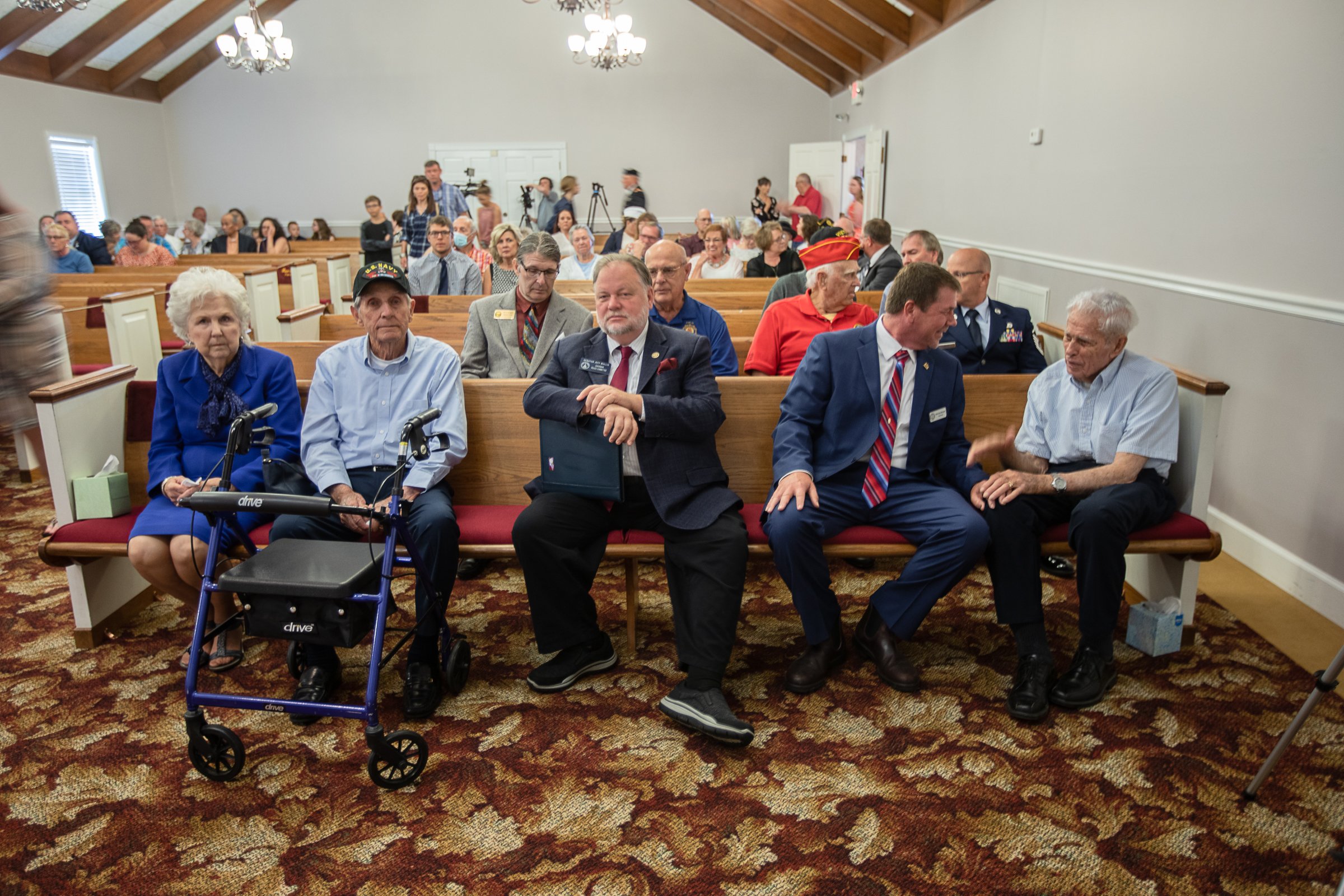 Staff photo by Troy Stolt / Residents of Ringgold, as well as friends and remaining family sit inside Wilson Funeral Home before a memorial service for Army Cpl. Henry L. Helms, who was killed in action during The Battle of Chosin Reservoir during the Korean War on Saturday, May 22, 2021 in Ringgold, Georgia. Helms, who was ruled missing in action for seven decades, was identified by his family and given full honors with funeral rites after a 2018 meeting between North Korean Chairman Kim Jong Un and former President Donald Trump, in which an agreement was struck to repatriate remains of Americans collected from the Korean War.