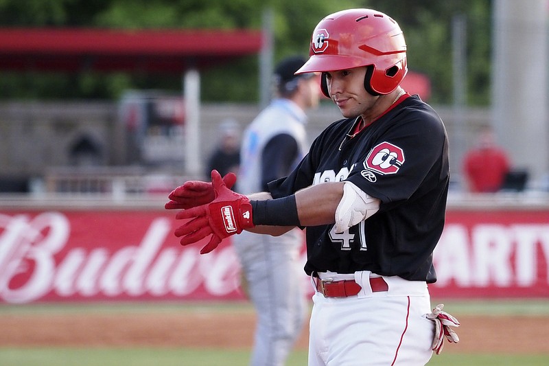 Staff photo by C.B. Schmelter / Chattanooga Lookouts second baseman Alejo Lopez celebrates after his RBI single earlier this month against the River City Trash Pandas at AT&T Field. Lopez has a .387 batting average that ranks third in Double-A South.
