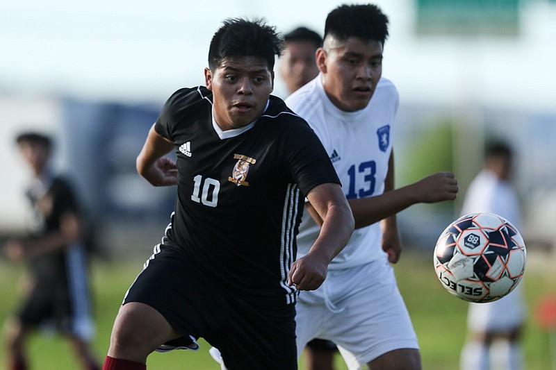 Staff photo by Troy Stolt / Howard's Jose Tomas Pascual (10) tracks down a pass during the District 8-AA championship soccer match between Howard and Red Bank high schools on Thursday, May 13, 2021 in Chattanooga, Tenn.