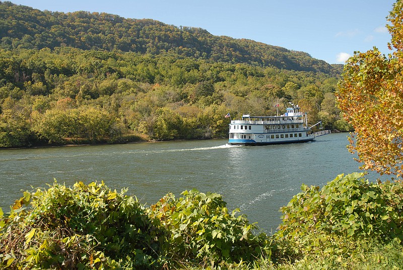 The Southern Belle riverboat travels downstream through the Tennessee River gorge at the Suck area as green leaves begin to give way to fall color in 2008 / Staff photo by Tim Barber
