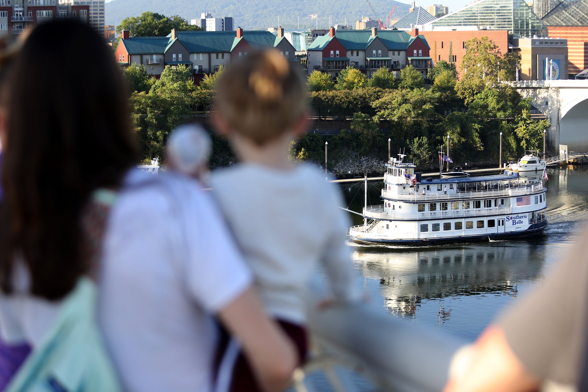 Staff photo by Erin O. Smith / The Southern Belle moves toward the Walnut Street Bridge before a few individuals aboard spoke to those on the bridge during the second annual Unity on the Bridge event Sunday, September 22, 2019 in Chattanooga, Tennessee. Speakers delivered messages to those on the bridge from the Southern Belle riverboat.