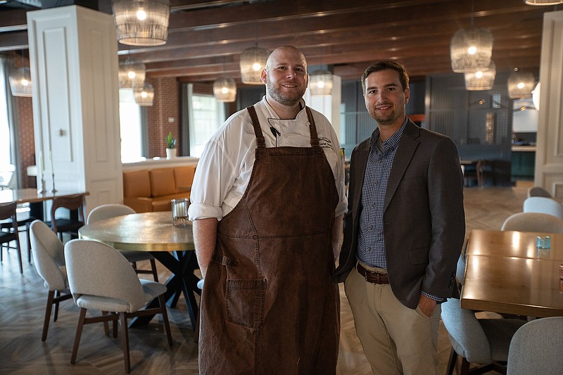 Staff photo by Troy Stolt / Chef Daniel Walters and Food and Beverage director Matt Reidt stand for a portrait inside of the dining room of Forge, the Chattanoogan Hotel's new restaurant on Tuesday, May 25, 2021 in Chattanooga, Tenn.