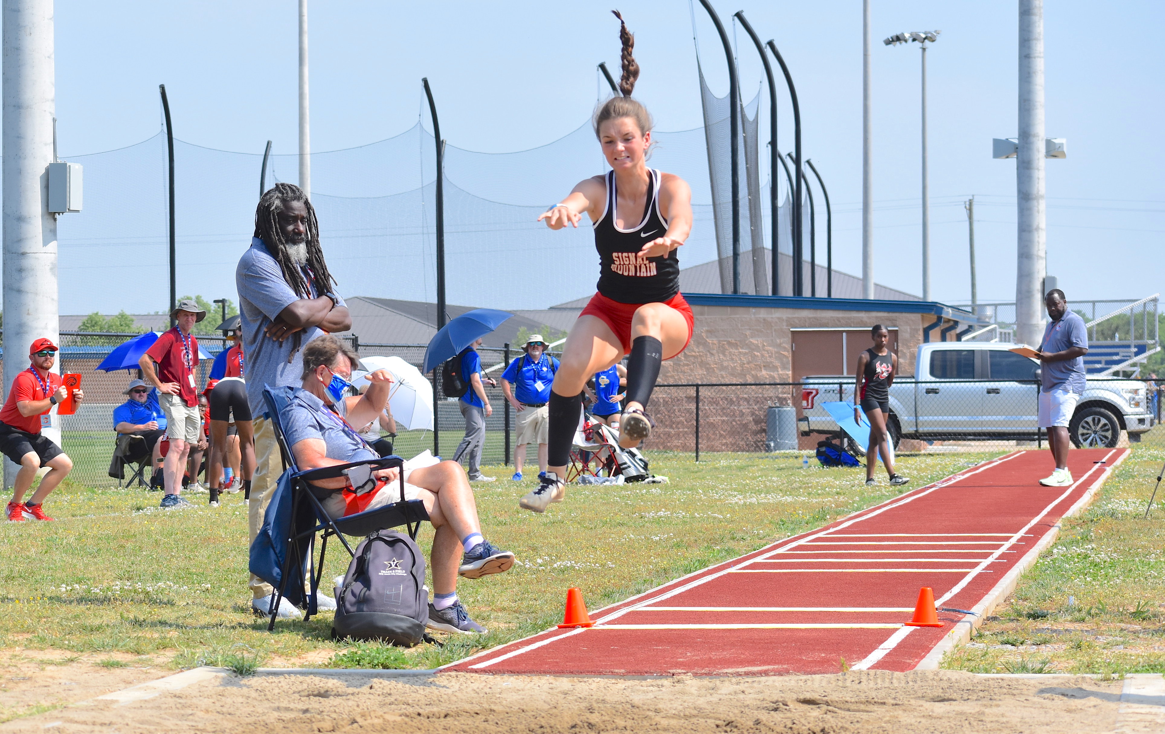Staff photo by Patrick MacCoon / Signal Mountain's Kara Wilson soars through the air during Tuesday's TSSAA Division I Small School long jump state championship held at Rockvale High School.