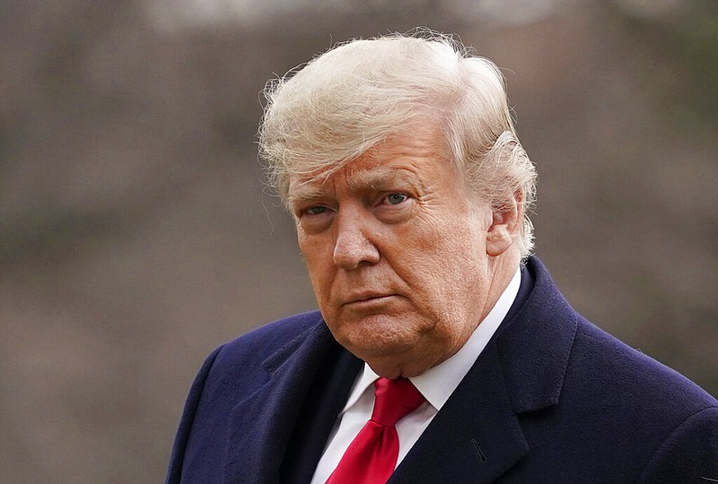 In this Dec. 31, 2020, file photo, President Donald Trump arrives on the South Lawn of the White House, in Washington. New York prosecutors have convened a special grand jury to consider evidence in a criminal investigation into Trump's business dealings, a person familiar with the matter told The Associated Press on Tuesday, May 25, 2021. (AP Photo/Evan Vucci, File)