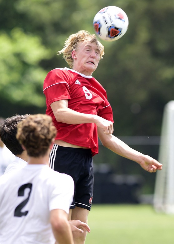 Staff Photo by Robin Rudd / Signal Mountain's Mats Dammann heads the ball in front of Madison Magnet's goal in TSSAA Spring Fling action in Murfreesboro on May 25, 2021.