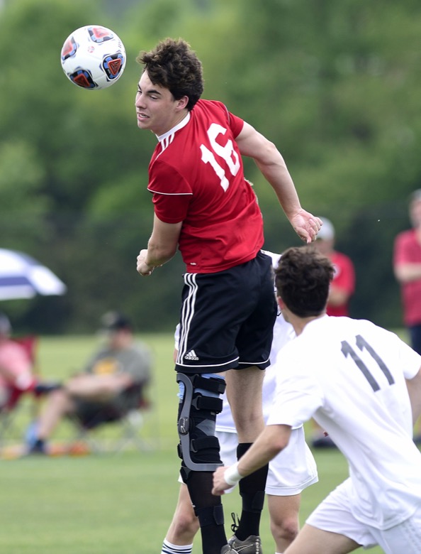 Staff Photo by Robin Rudd / Signal Mountain's Ethan Godbehere (16) directs the ball in front of Madison Magnet's goal in TSSAA Spring Fling action in Murfreesboro on May 25, 2021.