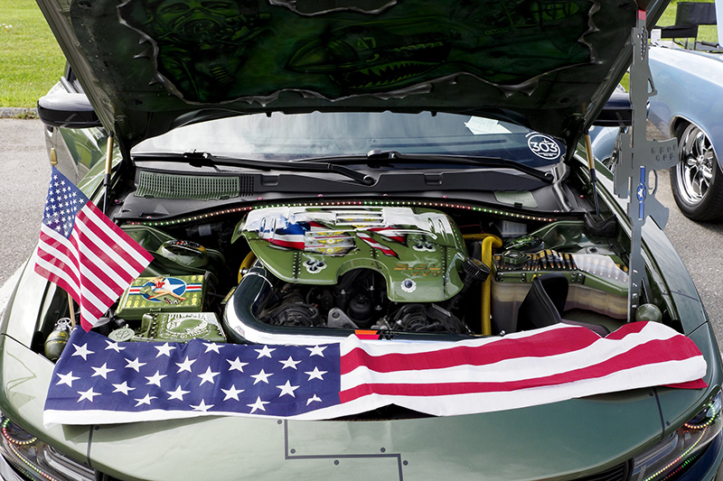 Staff photo by C.B. Schmelter / Military-themed details are seen under the hood of Garrett Roberts' 2018 Dodge Charger SXT.