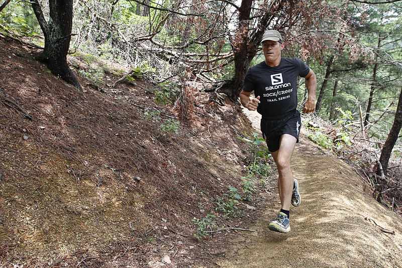 Staff file photo / Randy Whorton runs at Stringer's Ridge. After decades of 100-plus-mile ultramarathons, Whorton is now seeking new ways to test his endurance — and lightweight gear to help him go the distance.