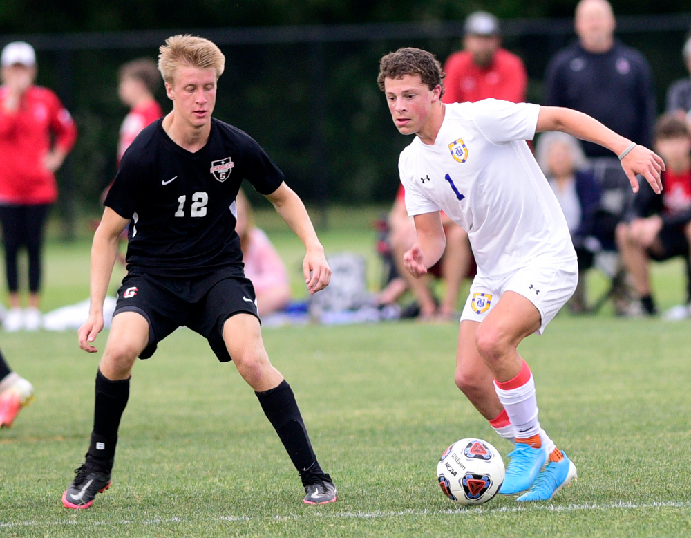 Staff Photo by Robin Rudd / Boyd-Buchanan's Mills Wood (1) moves the ball against Franklin Grace's Josh Hilner (12). Boyd-Buchanan faced Franklin Grace at the Sigel Soccer Complex in Murfreesboro on May 26, 2021.