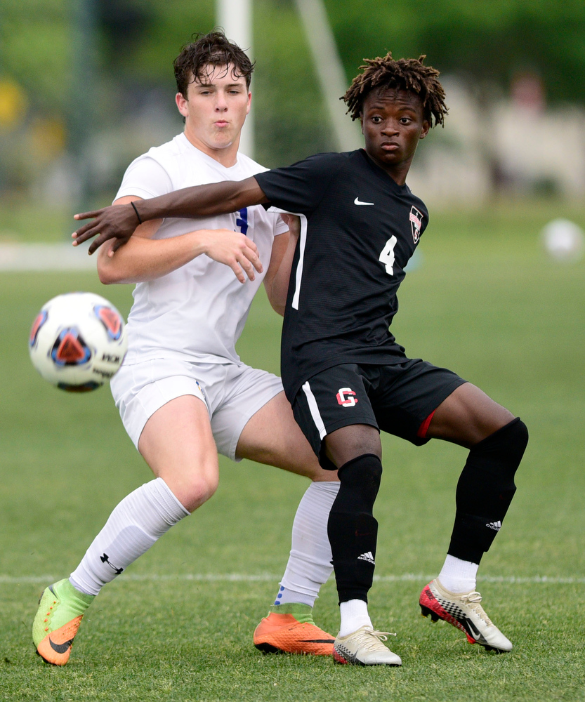 Staff Photo by Robin Rudd / Boyd-Buchanan's Matt Stone (3) and Franklin Grace's Levi Jones (4) fight for the ball. Boyd-Buchanan faced Franklin Grace at the Sigel Soccer Complex in Murfreesboro on May 26, 2021.