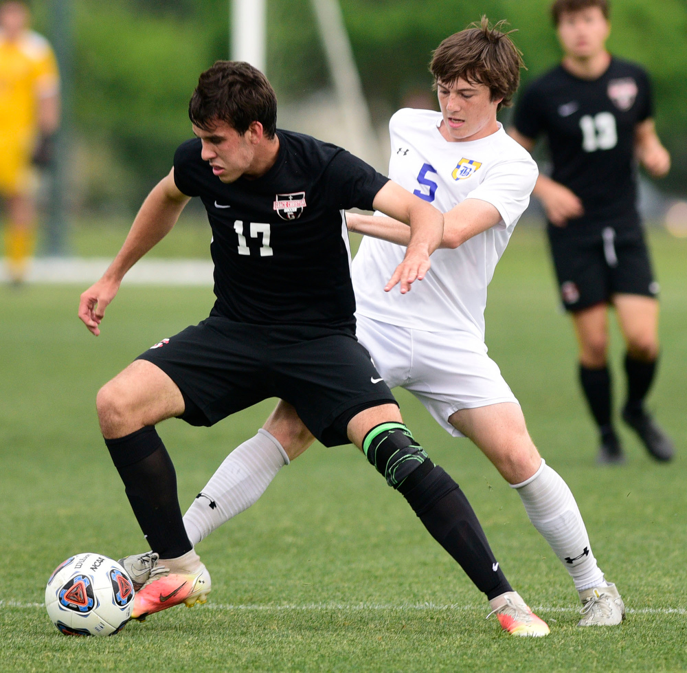 Staff Photo by Robin Rudd / Boyd-Buchanan's Ben Hauke (5) defends Franklin Grace's Nicholas Dial (6). Boyd-Buchanan faced Franklin Grace at the Sigel Soccer Complex in Murfreesboro on May 26, 2021.