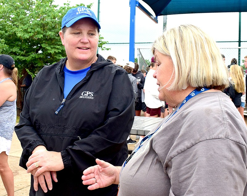 Staff photo by Robin Rudd / From left, Susan Crownover, the veteran GPS softball coach who took this year off for health reasons, talks with East Hamilton coach Norma Nelson during Spring Fling state tournament action Wednesday at the Starplex in Murfreesboro, Tenn.