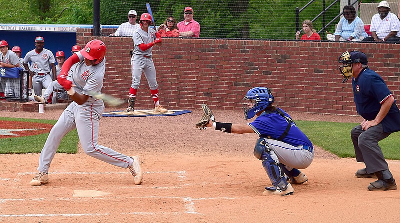 Staff photo by Robin Rudd / Baylor's Daniel Corona makes contact in front of McCallie catcher Frank Zahrobsky during a TSSAA Division II-AA state tournament game Wednesday at Wilson Central High School. Baylor won 4-1.