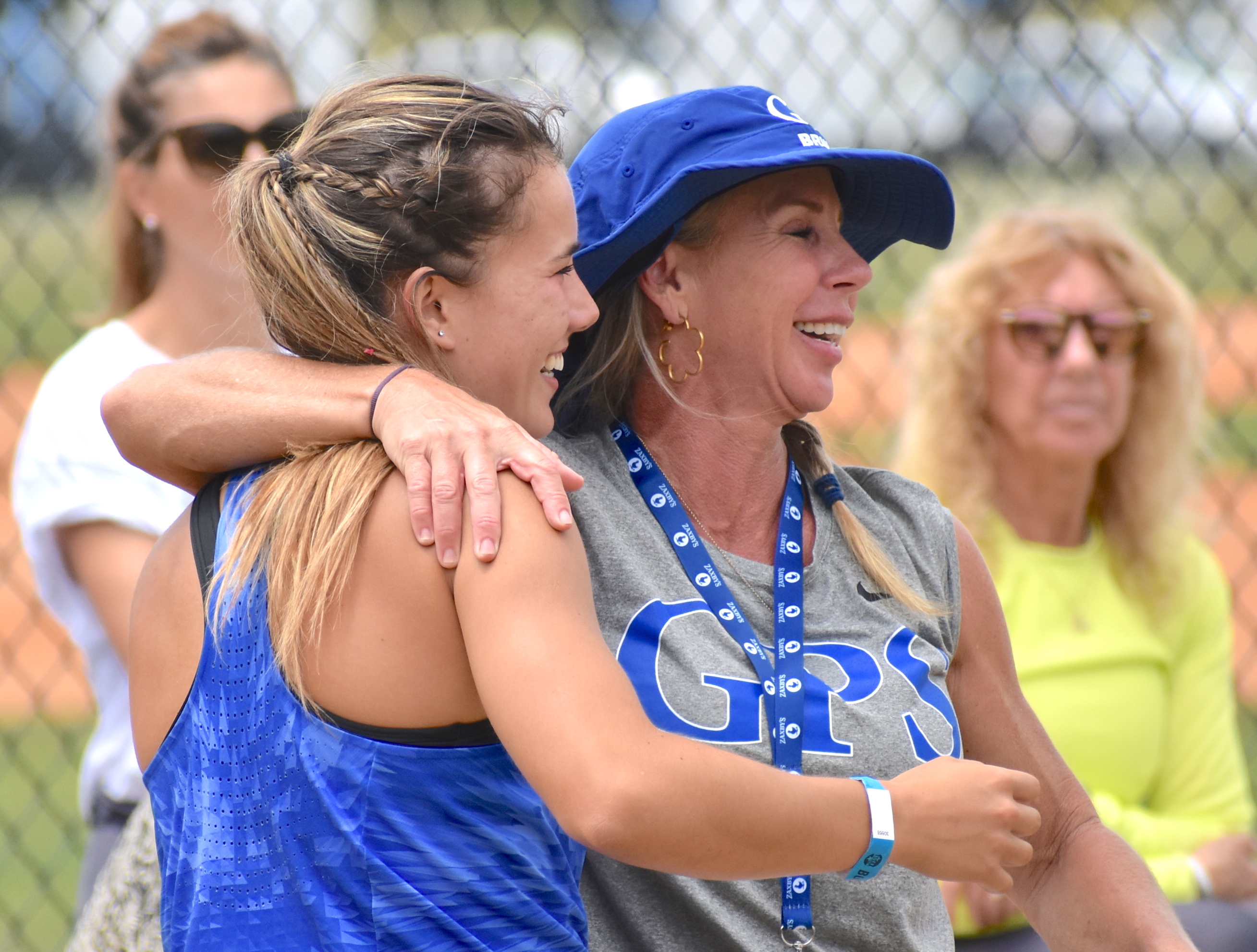 Staff photo by Patrick MacCoon / GPS senior Nicola Van der merwe, left, is all smiles with assistant coach Angela Warren after winning the triple jump at the TSSAA Division II-AA state meet Wednesday in Murfreesboro.