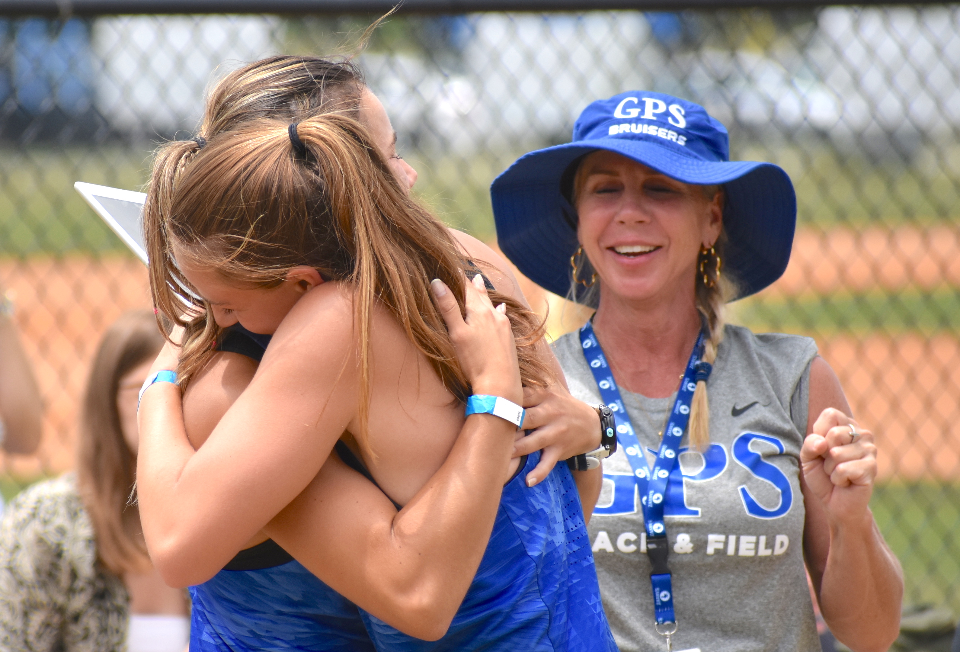 Staff photo by Patrick MacCoon / GPS celebrates Nicola Van der merwe's state championship in the triple jump at the TSSAA Division II-AA state meet Wednesday in Murfreesboro.