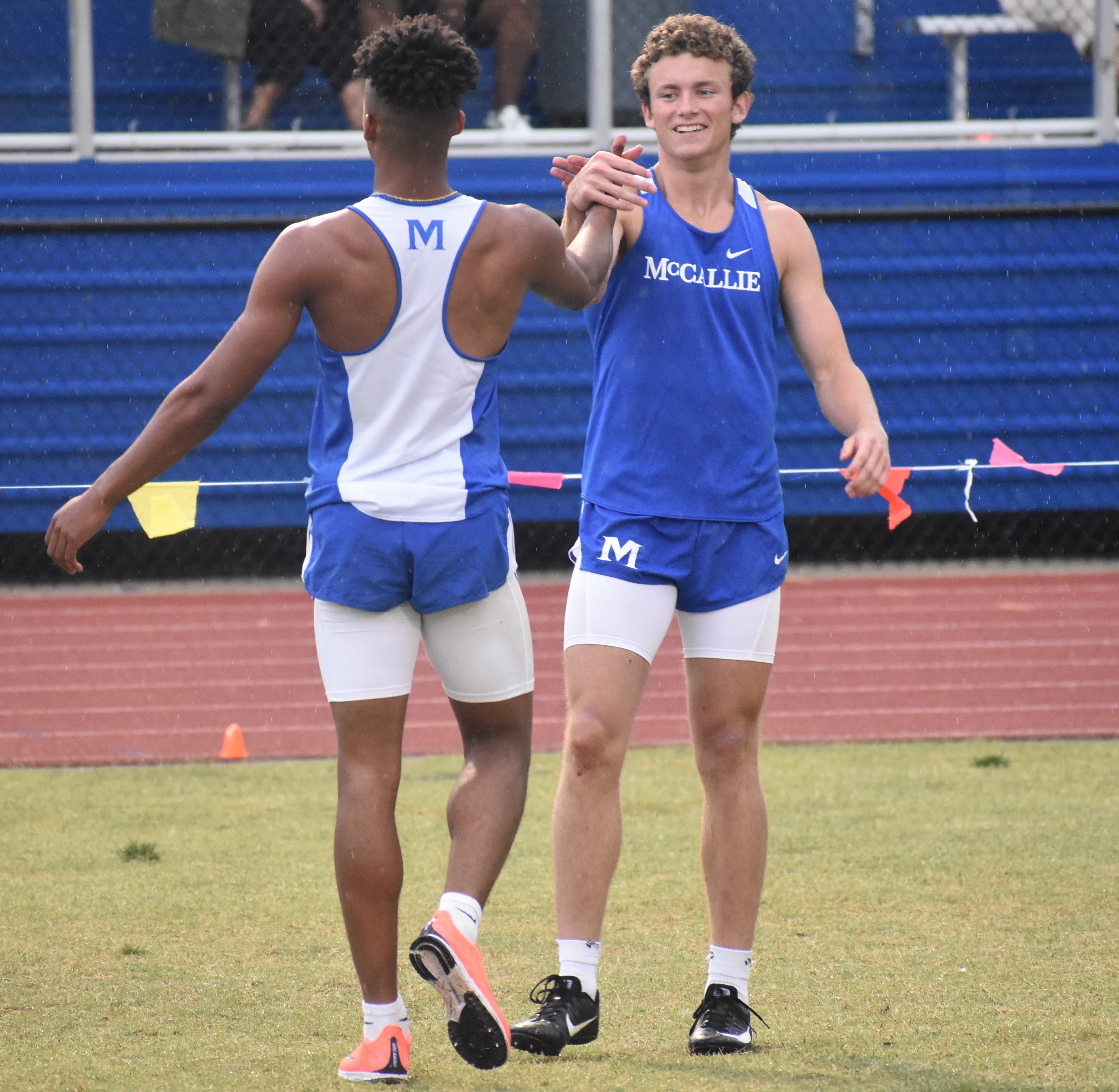 Staff photo by Patrick MacCoon / McCallie's Eric Rivers, left, celebrates with teammate John Kohl after they helped the Blue Tornado win the 4x100 relay at the TSSAA Division II-AA state meet Wednesday in Murfreesboro.