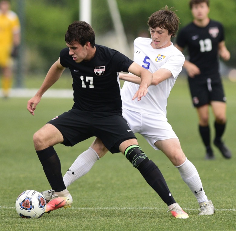 Staff Photo by Robin Rudd / Boyd-Buchanan's Ben Hauke (5) defends Franklin Grace's Nicholas Dial (6). Boyd-Buchanan faced Franklin Grace at the Sigel Soccer Complex in Murfreesboro on May 26, 2021.