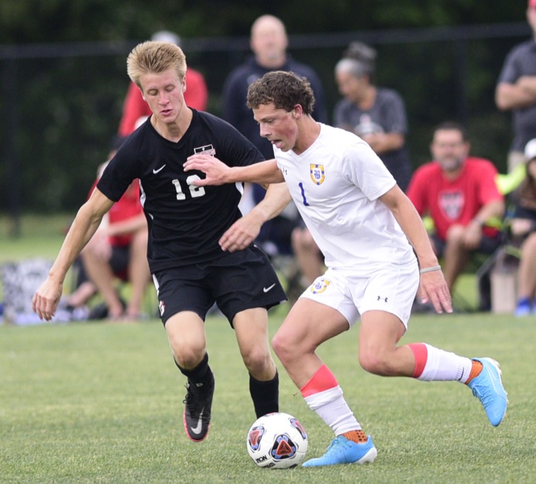 Staff Photo by Robin Rudd / Boyd-Buchanan's Mills Wood (1) moves the ball against Franklin Grace's Josh Hilner (12). Boyd-Buchanan faced Franklin Grace at the Sigel Soccer Complex in Murfreesboro on May 26, 2021.