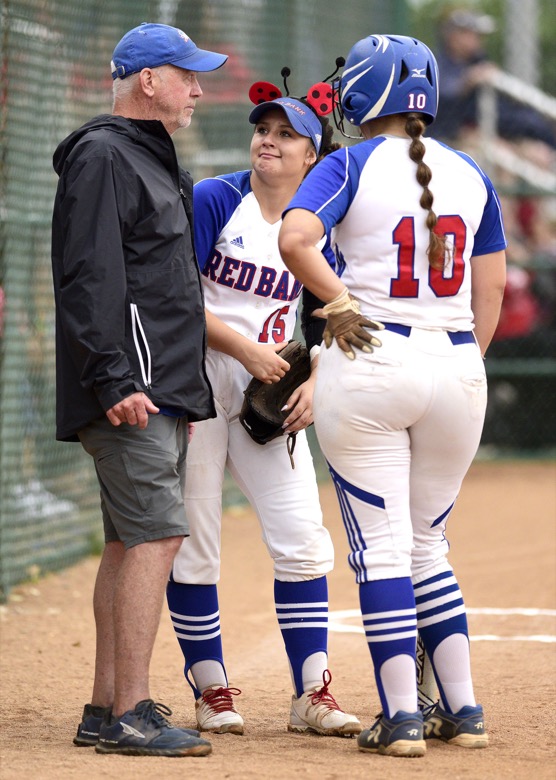 Staff Photo by Robin Rudd / Red Bank assistant coach Richard Long talks with Taylor Bono (15) and Zoe Helms (10) before the game. Red Bank played Lexington in TSSAA Spring Fling softball at the Starplex in Murfreesboro on May 26, 2021.