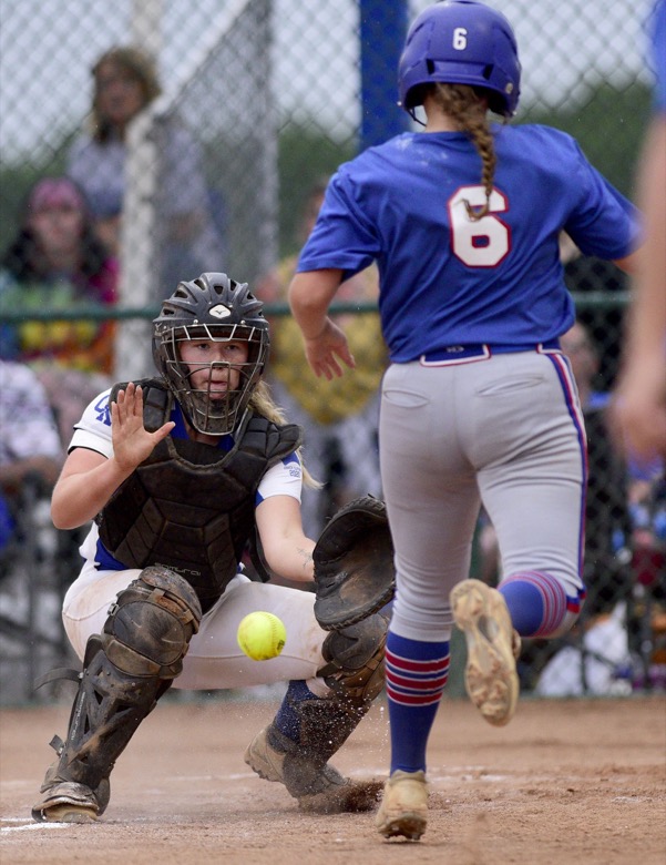 Staff Photo by Robin Rudd / Sale Creek catcher Hannah Baskette-Skiles (17) takes the throw at home and will tag Huntland's Deanna Burton (6) out. Sale Creek played Huntland in TSSAA Spring Fling softball at the Starplex in Murfreesboro on May 26, 2021.