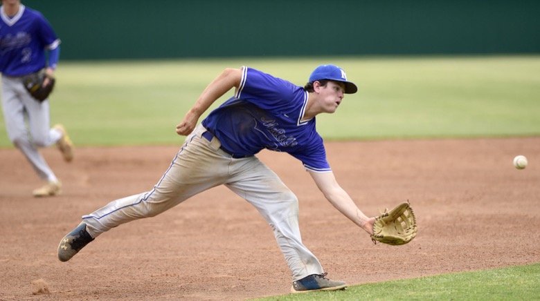 Staff Photo by Robin Rudd / McCallie third baseman Carter Hewitt (22) fields a ground ball. Baylor faced McCalliein TSSAA Spring Fling baseball at Wilson Central High School in Galdeville on May 26, 2021.
