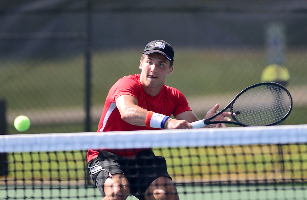 Staff Photo by Robin Rudd / Collegedale Academy's Joby Nash charges the net and hits a winner to Lusanne's Danny Hamze during TSSAA Spring Fling tennis at the Adams Tennis Complex in Murfreesboro on May 27, 2021.