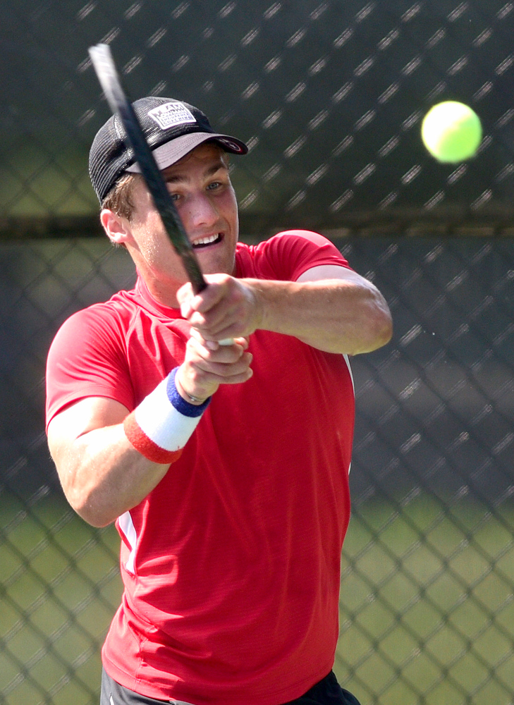 Staff Photo by Robin Rudd / Collegedale Academy's Joby Nash hits a backhand to Lusanne's Danny Hamze during TSSAA Spring Fling tennis at the Adams Tennis Complex in Murfreesboro on May 27, 2021.