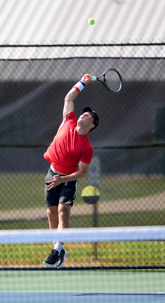 Staff Photo by Robin Rudd / Collegedale Academy's Joby Nash jumps as he serves to Lusanne's Danny Hamze during TSSAA Spring Fling tennis at the Adams Tennis Complex in Murfreesboro on May 27, 2021.