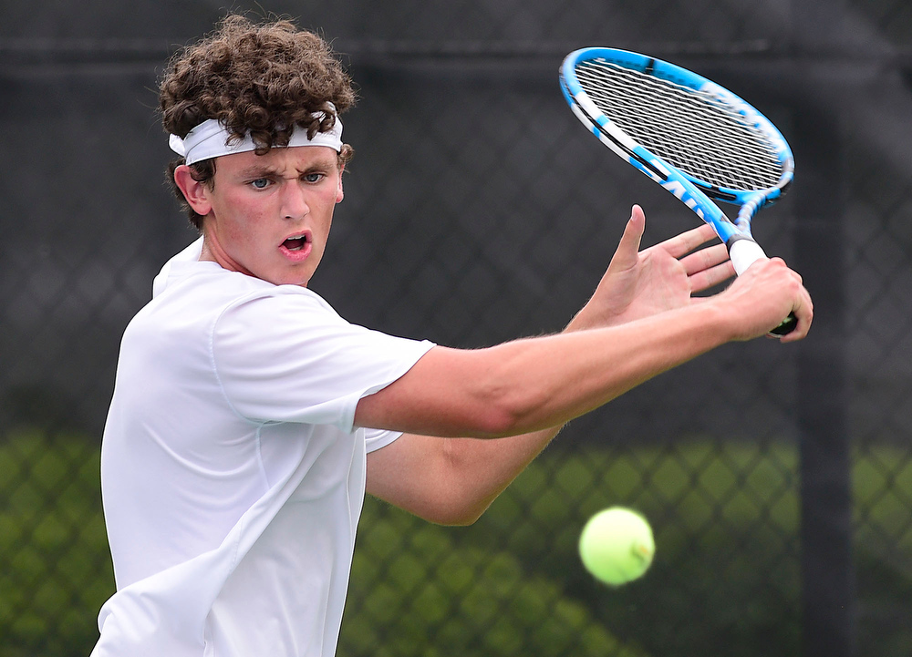 Staff Photo by Robin Rudd / Walker Valley's Jacob Johnson hits a backhand during his match with Collierville's Ranjay Auil at the Adams Tennis Complex in Murfreesboro on May 27, 2021.