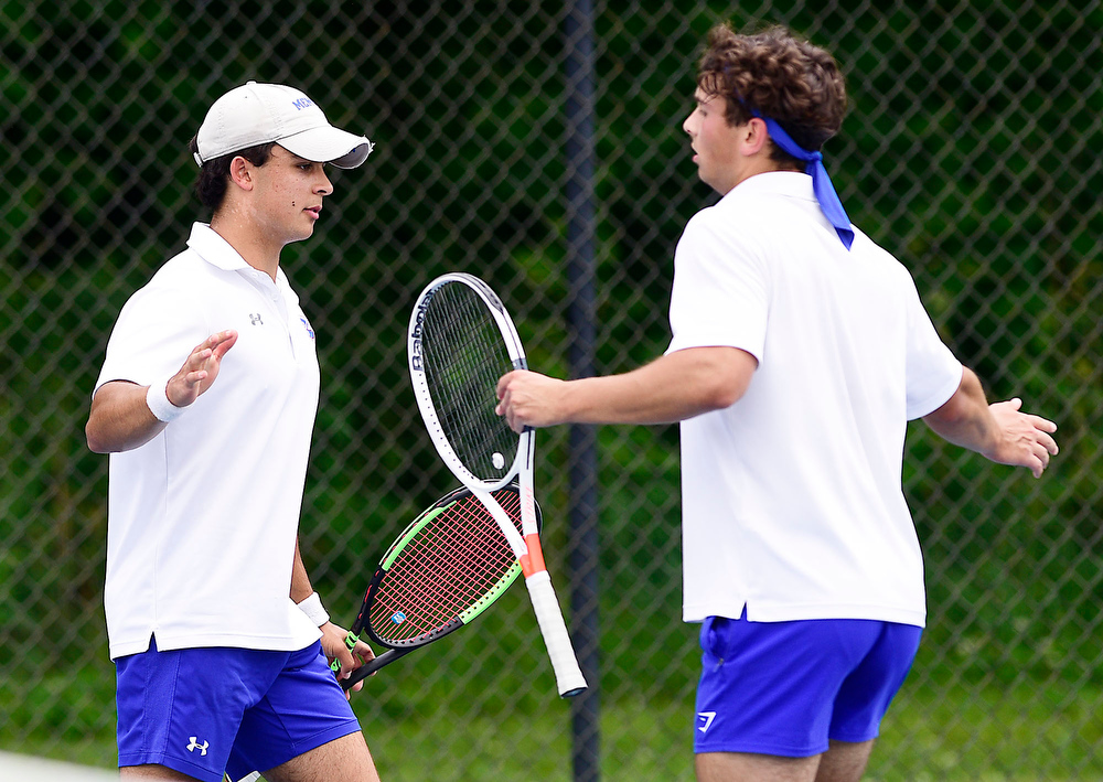 Staff Photo by Robin Rudd / From left, Cleveland's Brayden Conn slap hands with teammate Bryce Elliott during their match with Science Hill's Om Patel and Daniel Haddadin. TSSAA Spring Fling tennis continued at the Adams Tennis Complex in Murfreesboro on May 27, 2021.